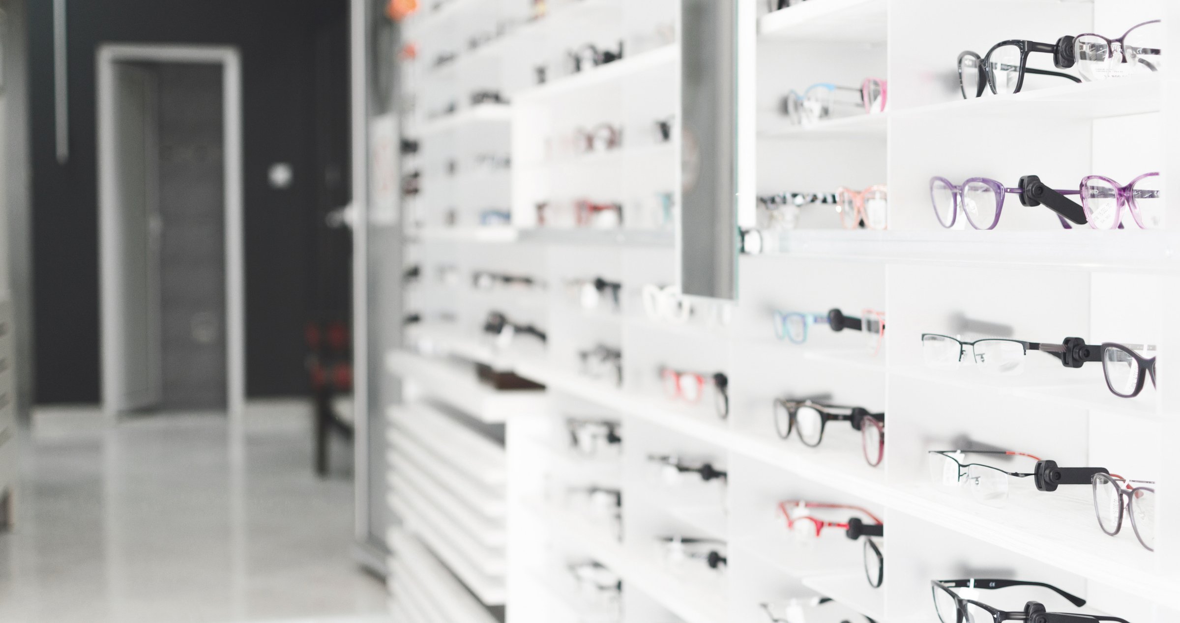 Image of a wall of spectacles at a optometrist