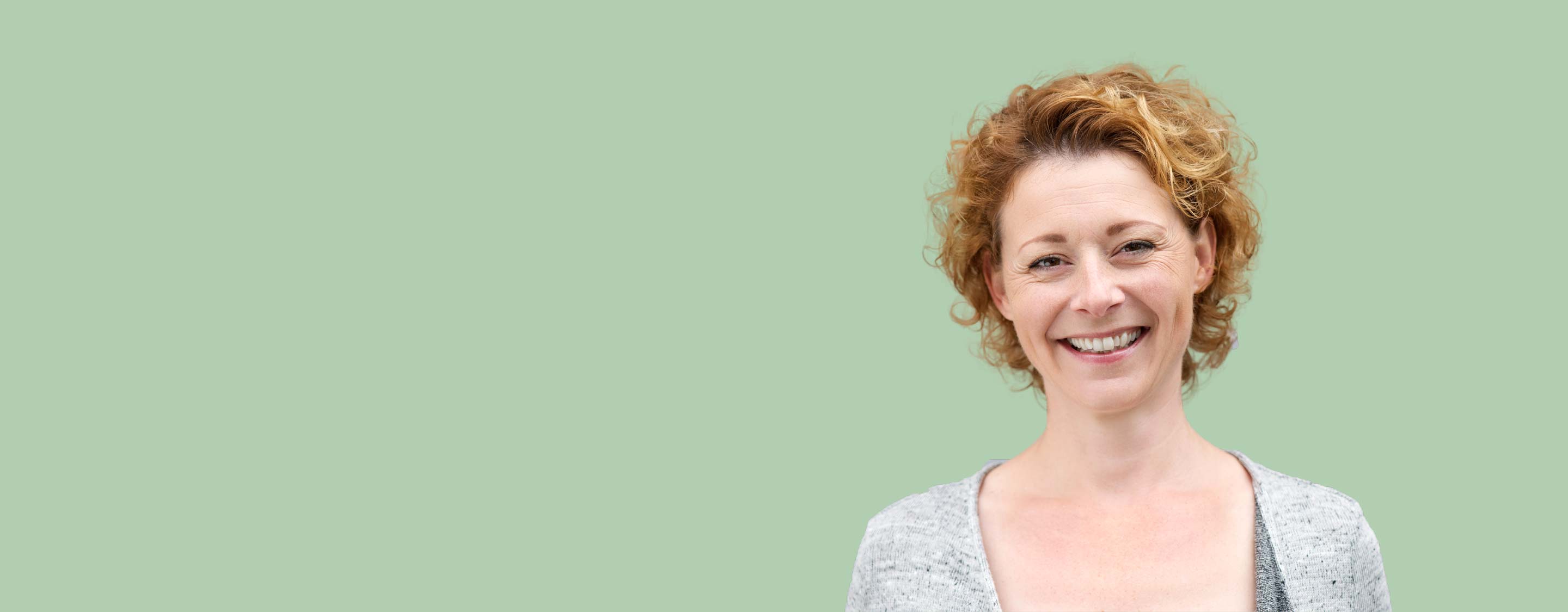 Blonde lady with pale green background