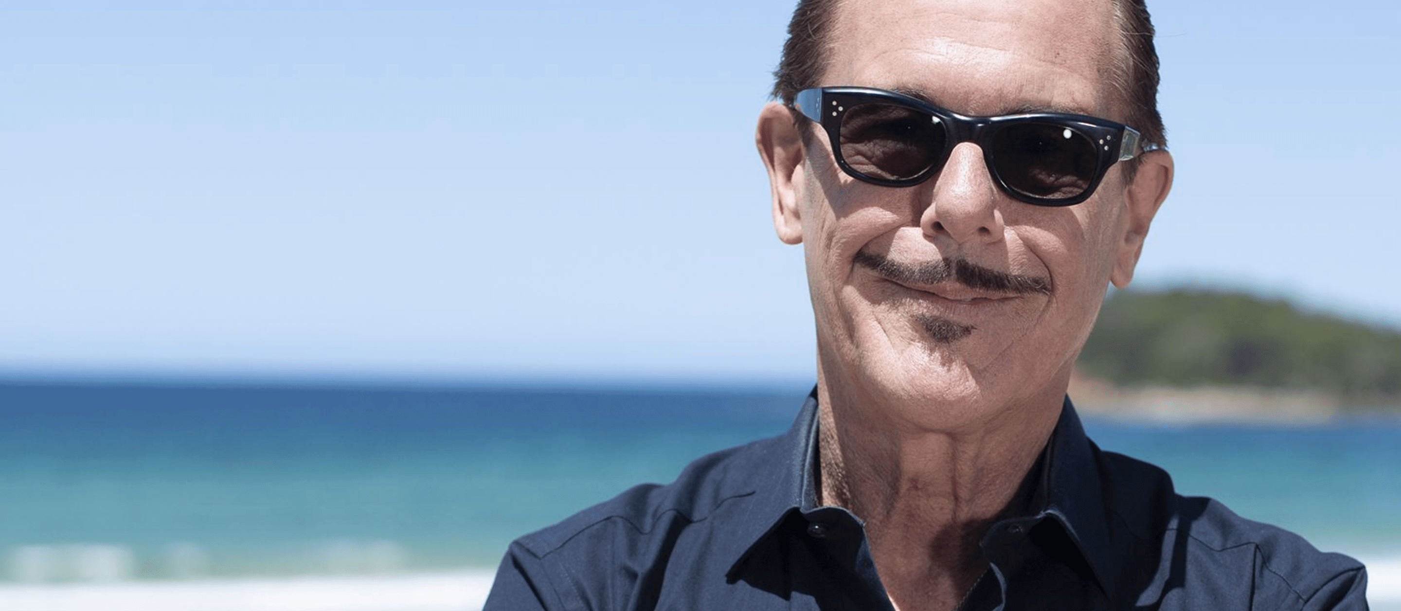 Kirk Pengilly of INXS on beach in Manly
