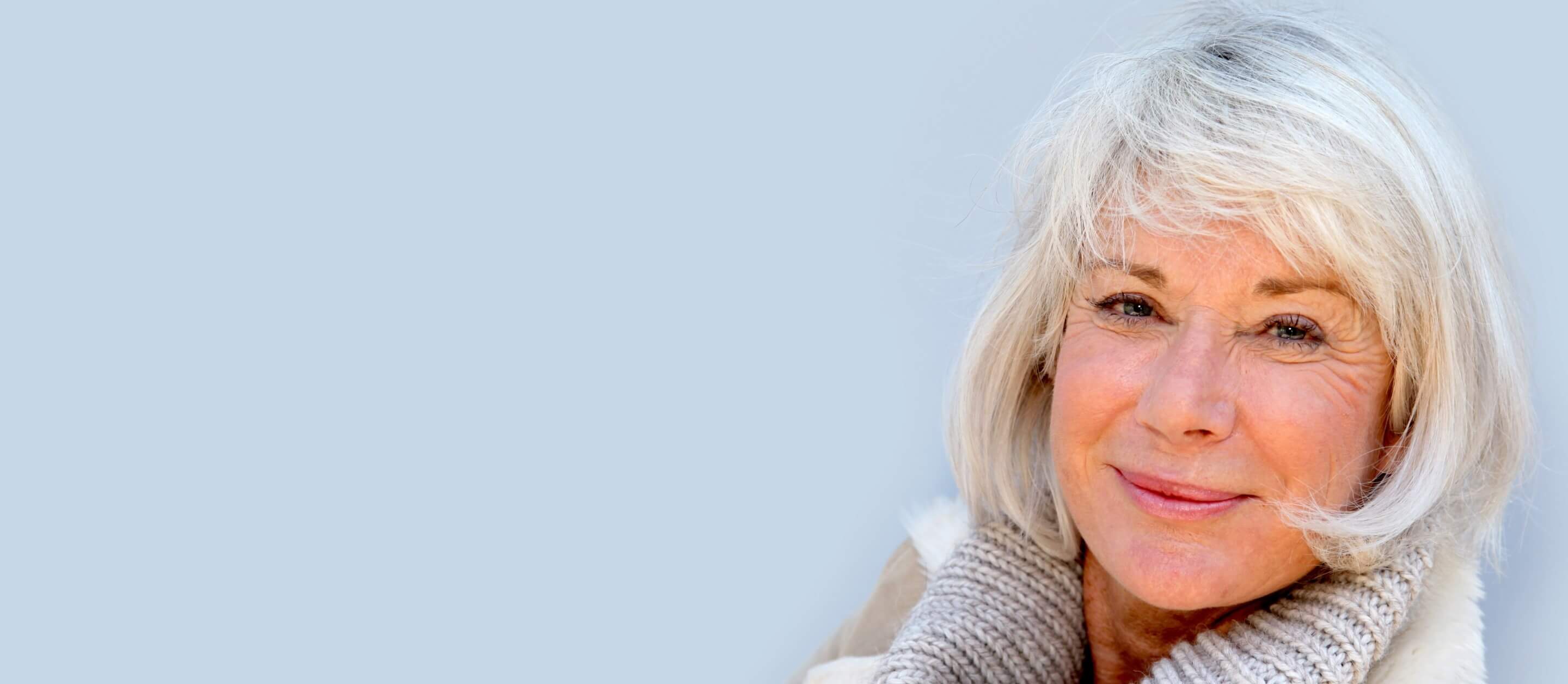 Friendly looking older woman smiling at the camera