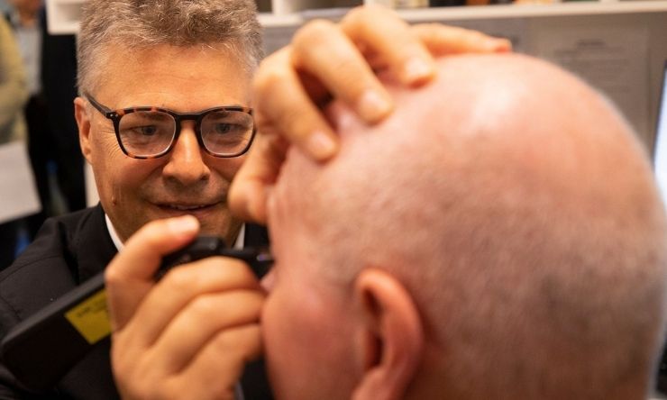 Professor Jamie Craig giving eye test on patient