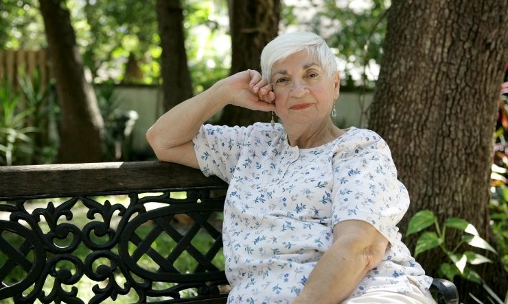 Older woman resting on park bench