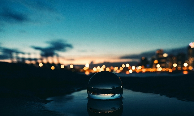 Image of crystal ball with evening twilight in background