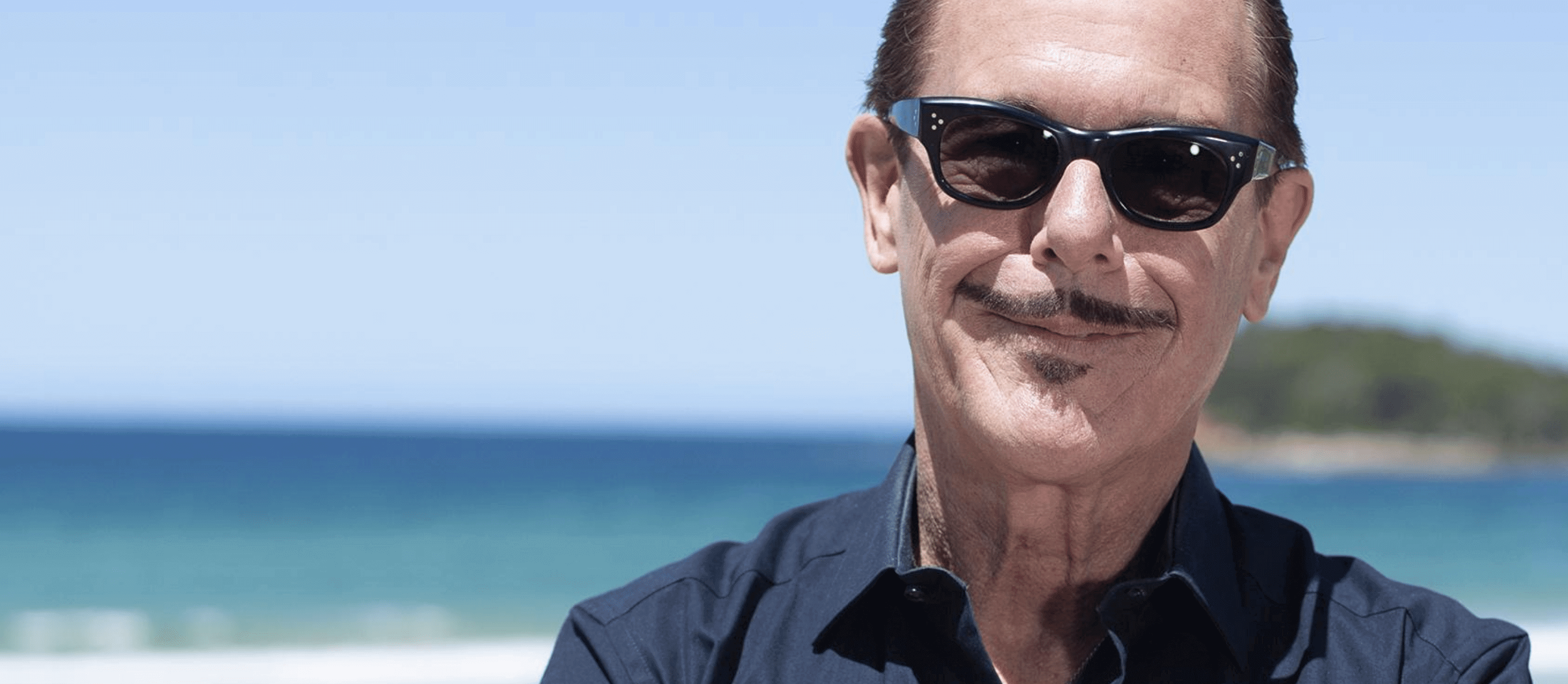 image of Kirk Pengilly with ocean in background