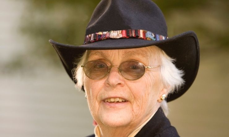 image of older lady wearing black akubra hat and sunglasses