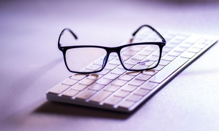 Image of reading glasses placed on a computer keyboard