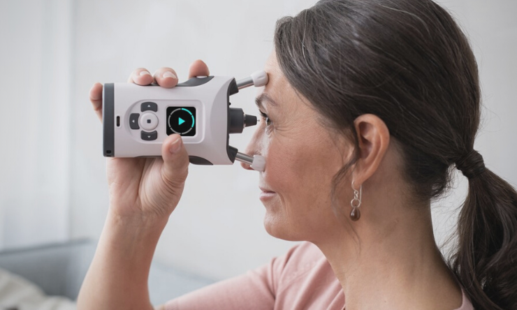 Image of woman using the iCare Home2 Tonometer