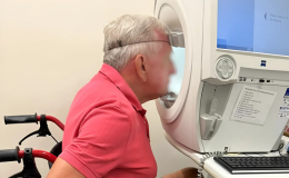  A patient in wheelchair doing a visual field test 