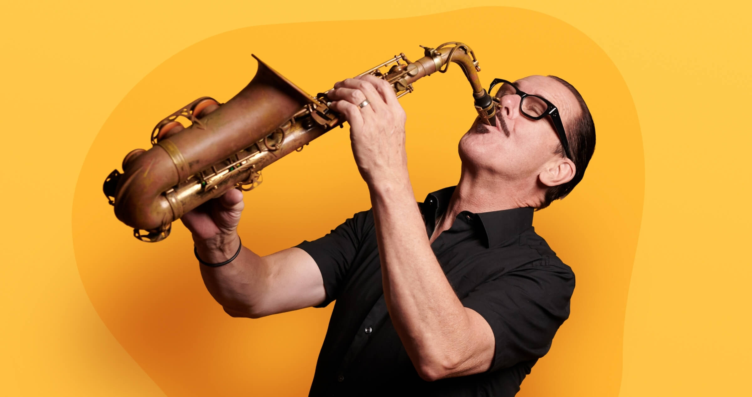 Image of Kirk Pengilly playing saxophone