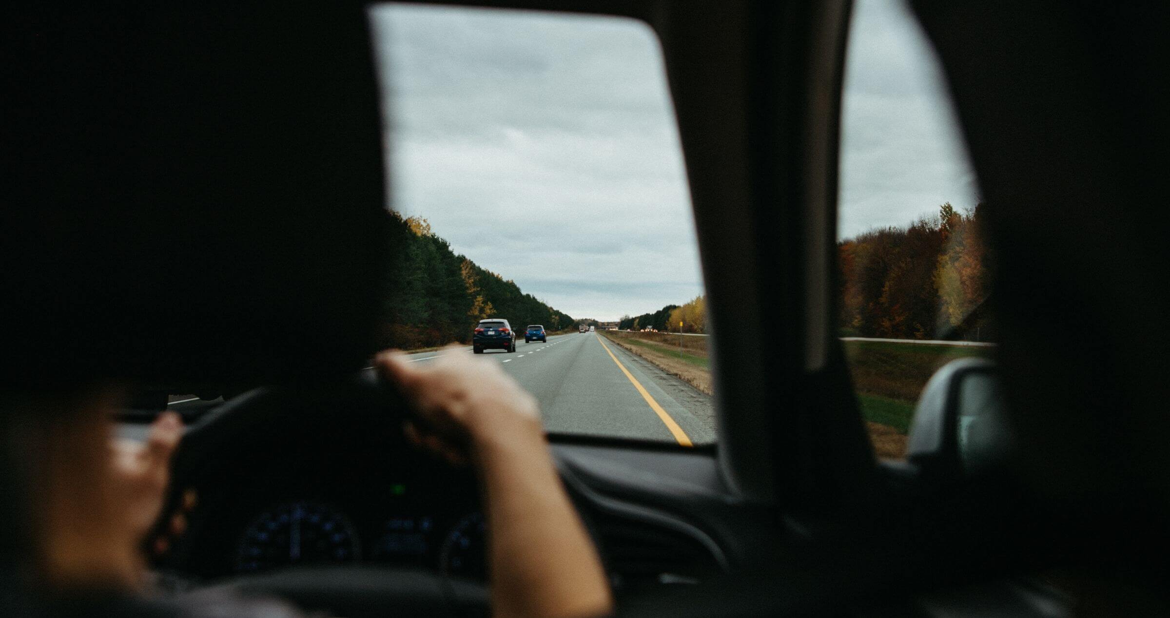 Image of road ahead from behind driver's seat