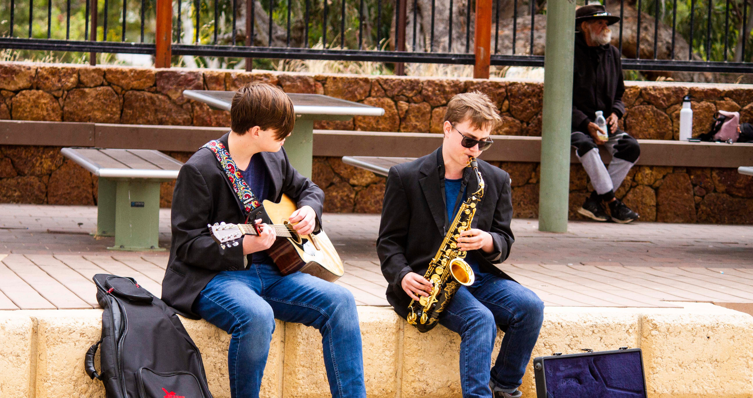 Image of Cody playing saxophone alongside his friend