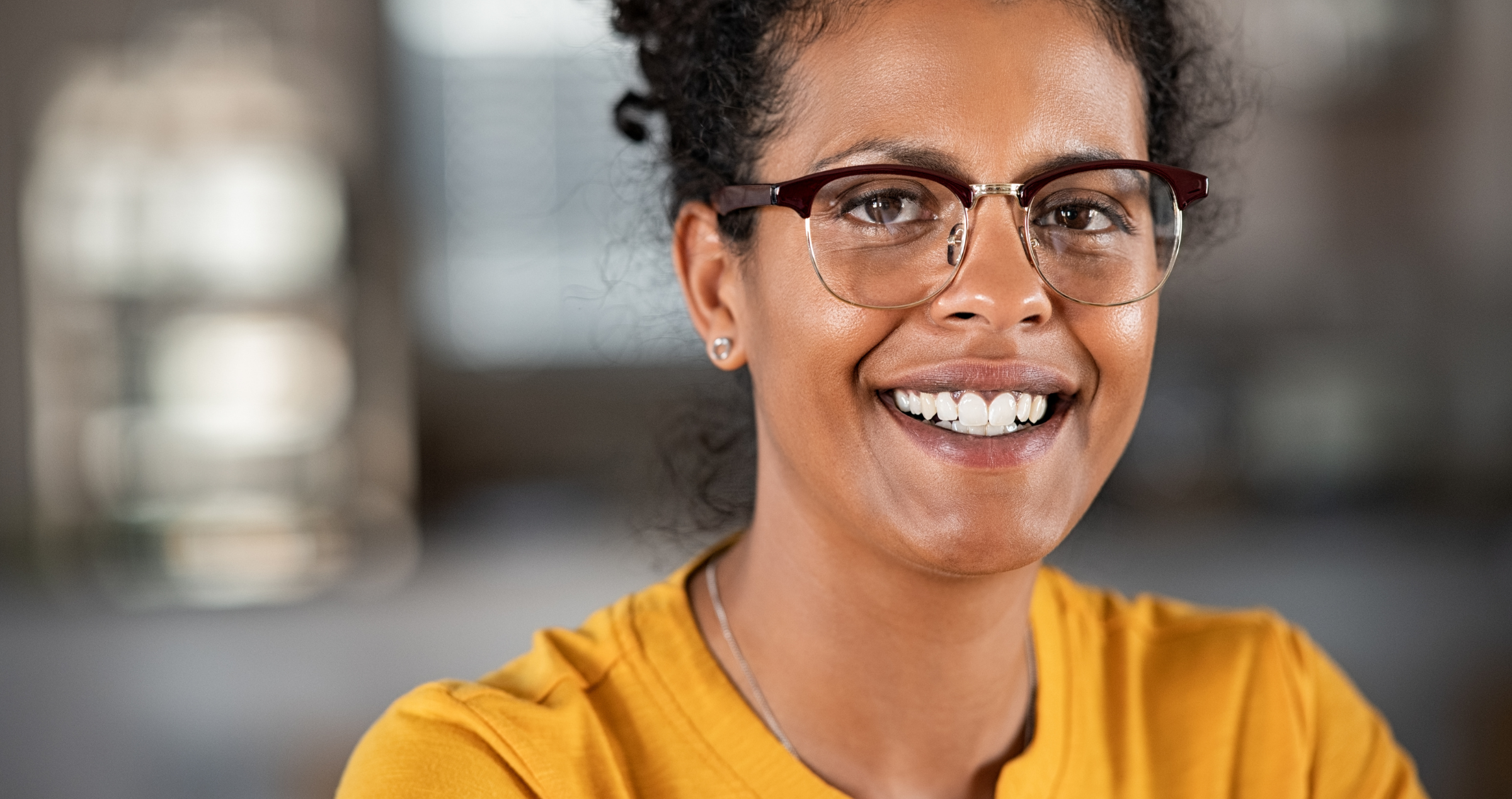 Image of a woman with African heritage smiling