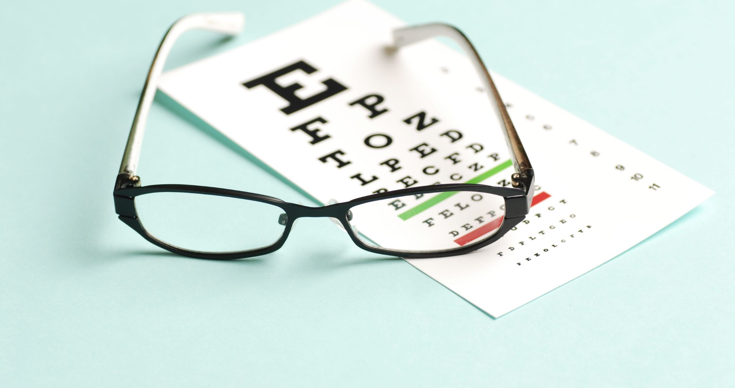Image of reading glasses on eye sight test