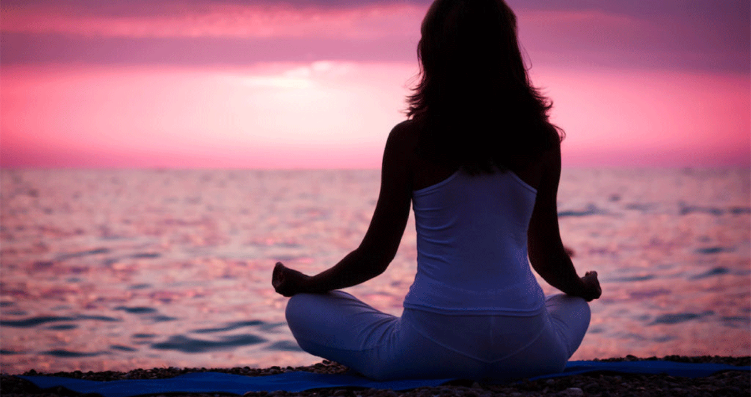 lady meditating by the beach