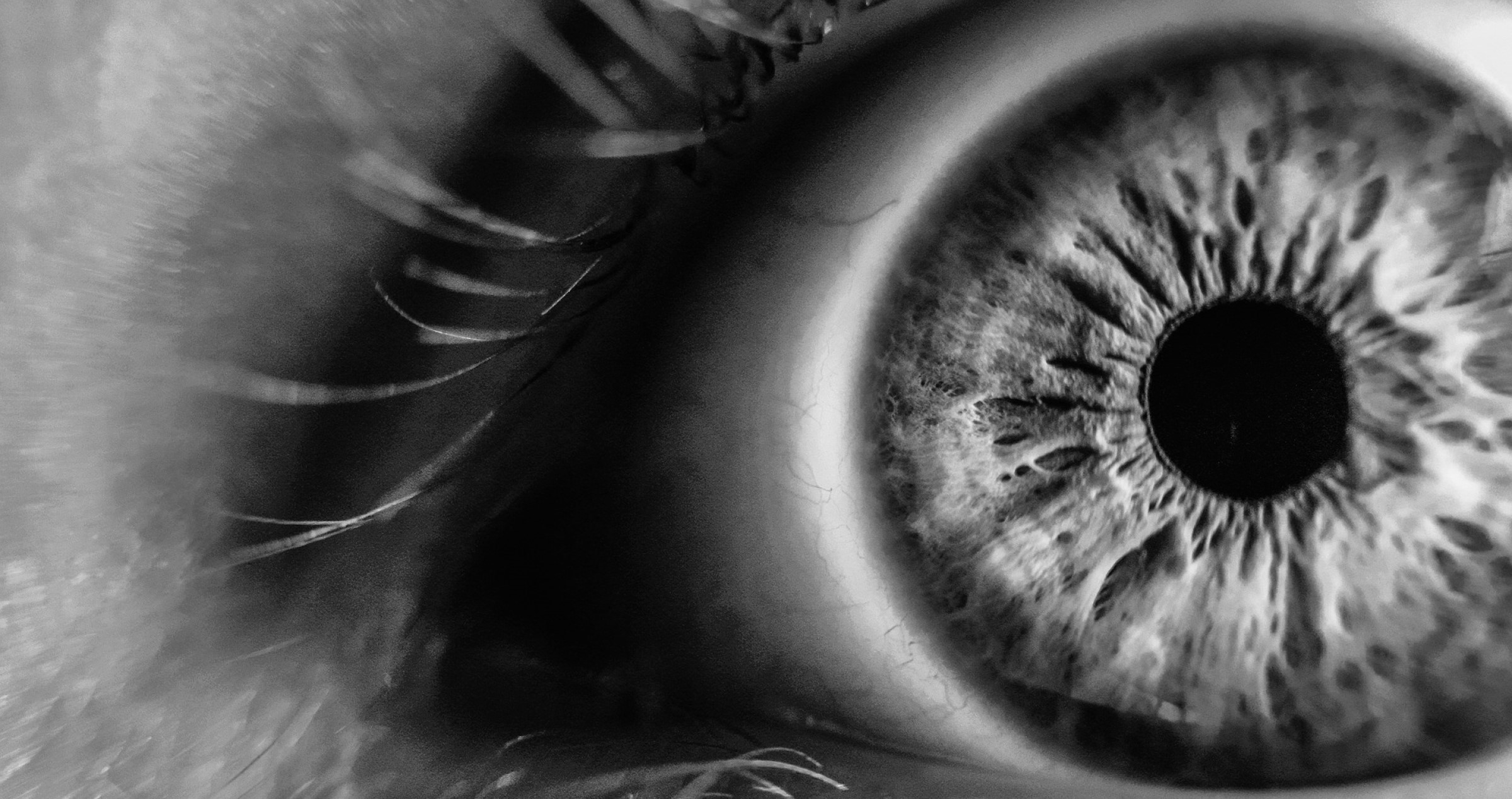 Black and white image of a close up of an eye