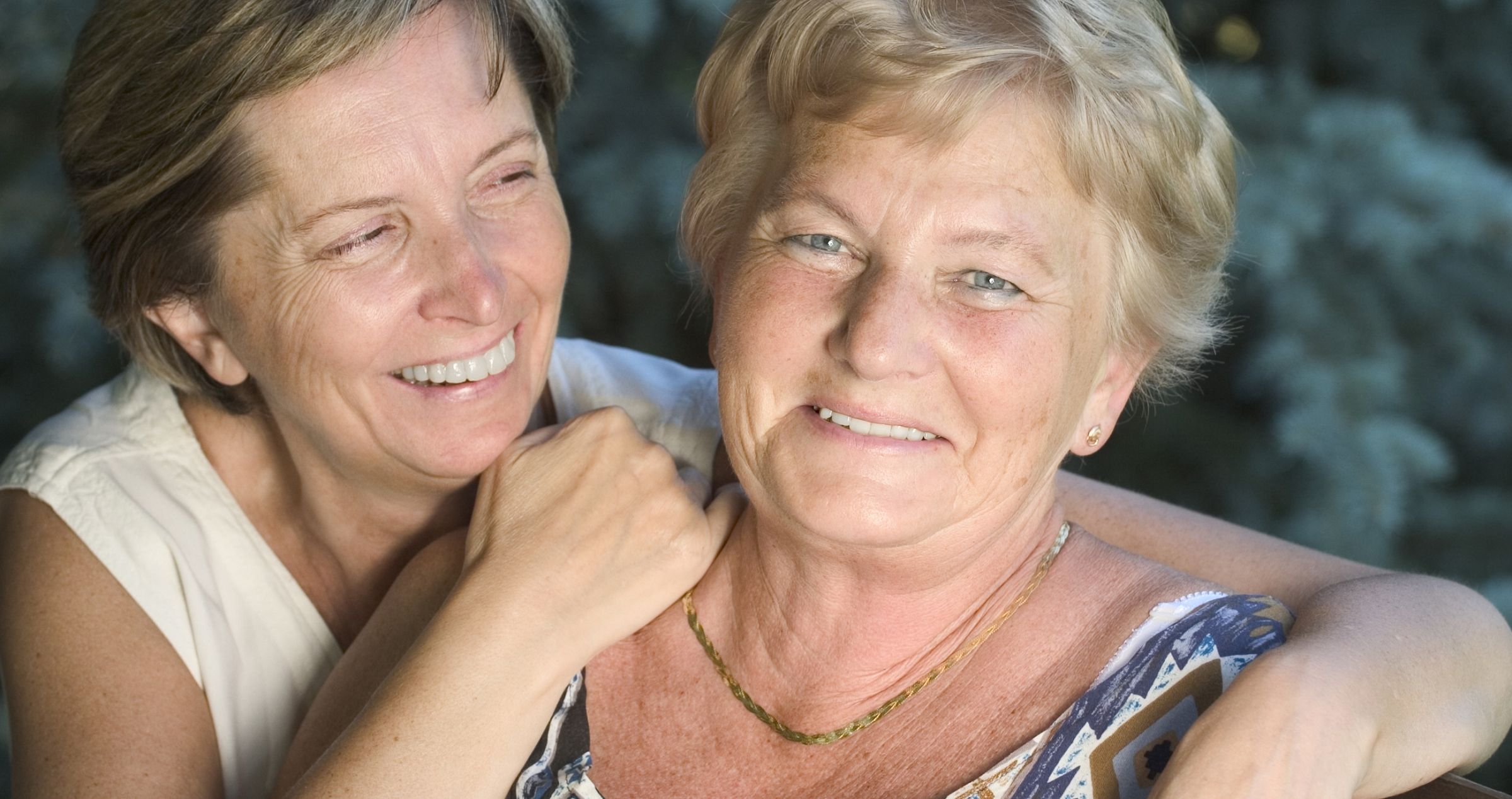 Two smiling middle aged women