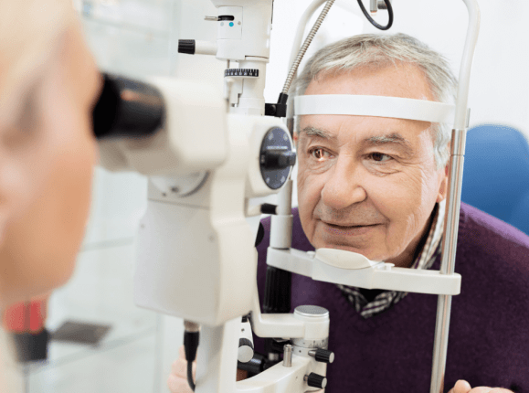 Male glaucoma patient having his eyes checked by an ophthalmologist