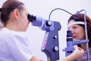 Ophthalmologist treatment a female patient using laser treatment for glaucoma